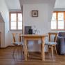 Leopold an der Ybbs, © © Niederösterreich Werbung/ Maximilian Pawlikowsky Cozy living area with wooden table, two chairs and sofa.