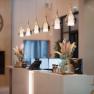 Elegant hotel reception with modern lamps and decorations.