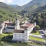 Aerial view of Lilienfeld Abbey surrounded by green hills and forests.