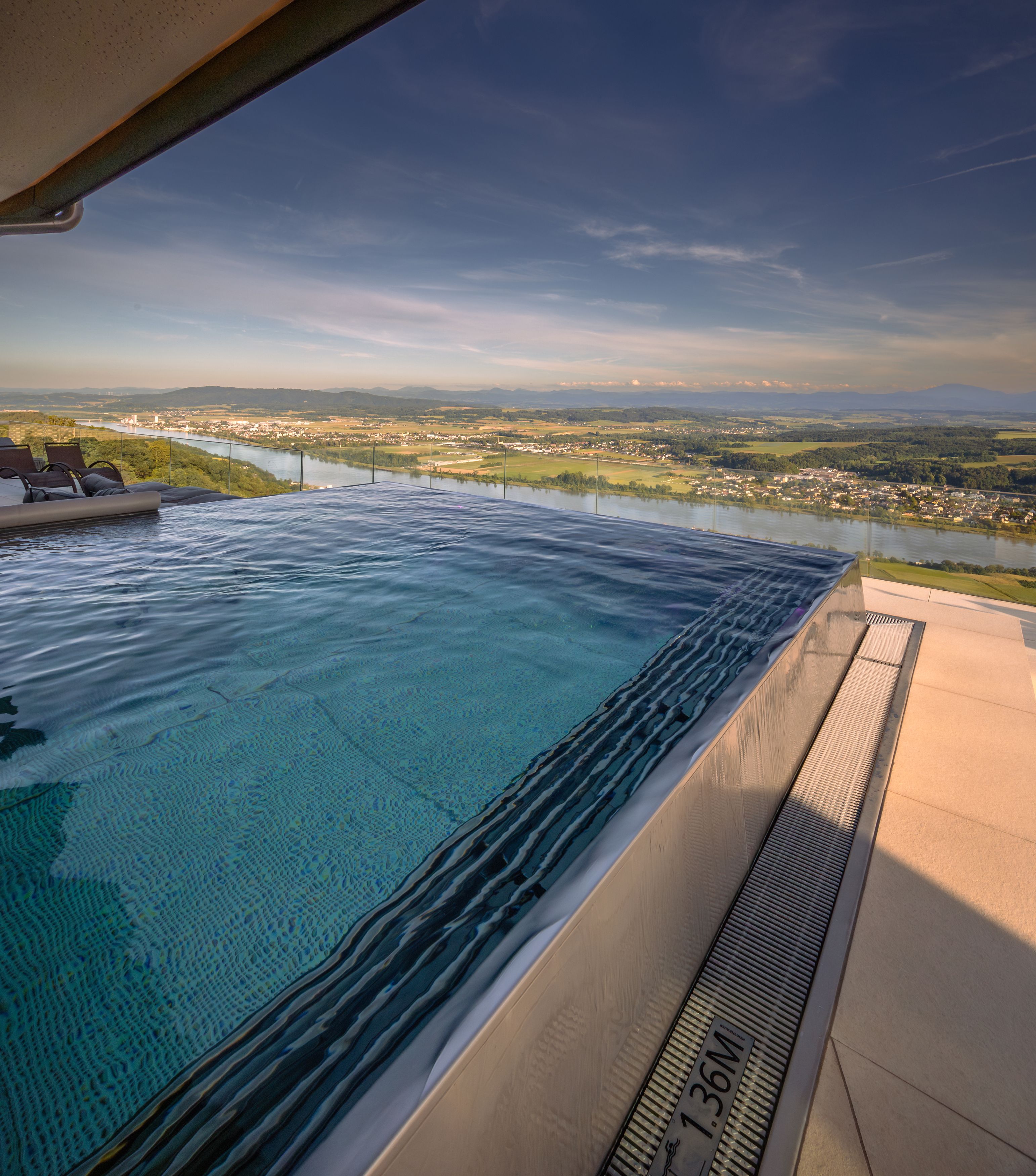 Infinity pool with views of the river and countryside.