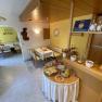 Breakfast room with laid tables and breakfast buffet.