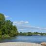 River landscape with trees and a ship on the Danube.
