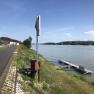 Jetty on the banks of the Danube in Marbach, surrounded by green countryside and blue skies.