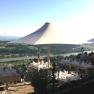 Terrace with tables and parasols, view of the river and countryside.