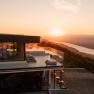 Modern hotel with terrace and river view at sunset and view over the Danube.