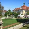 Seitenstetten Abbey with a green meadow and blue sky.