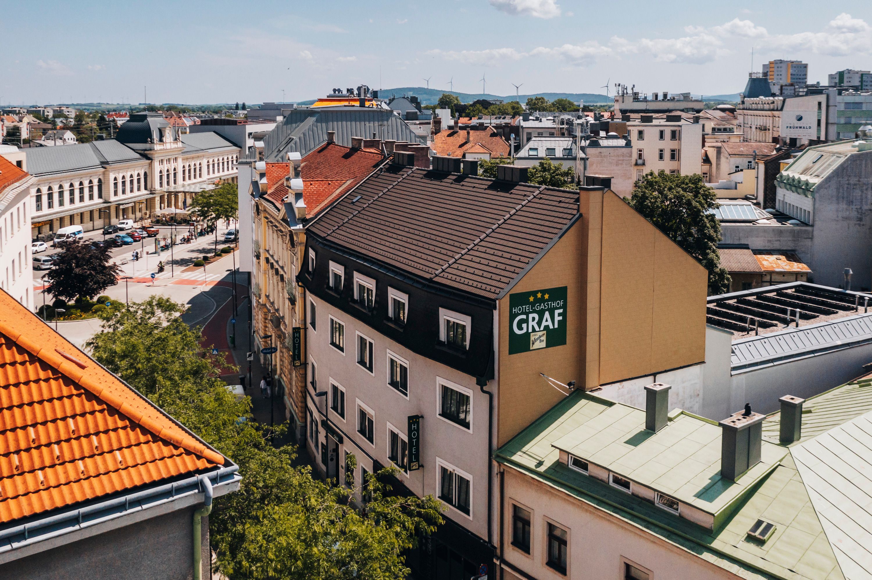 Aerial view of a hotel-inn in St. Pölten with surrounding buildings and streets.