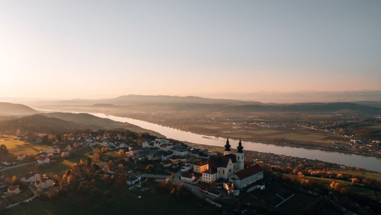 Aerial view of Maria Taferl with the Danube in the background at sunset.